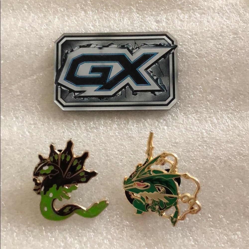 Pokémon pins and game piece